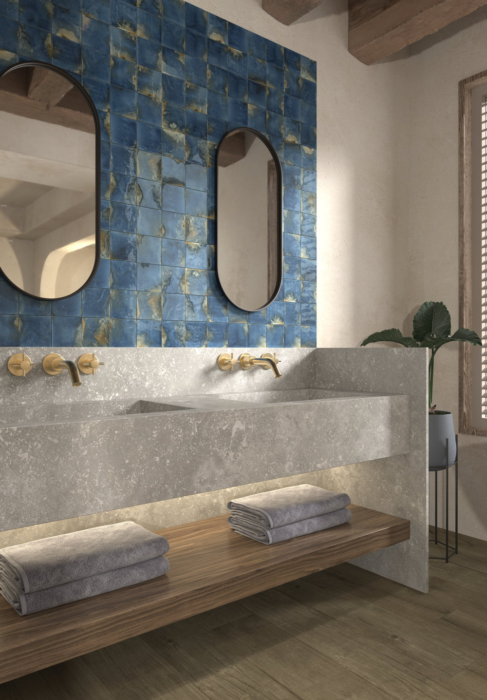 Deep blue glossy tiles in a café-style interior with black fixtures.