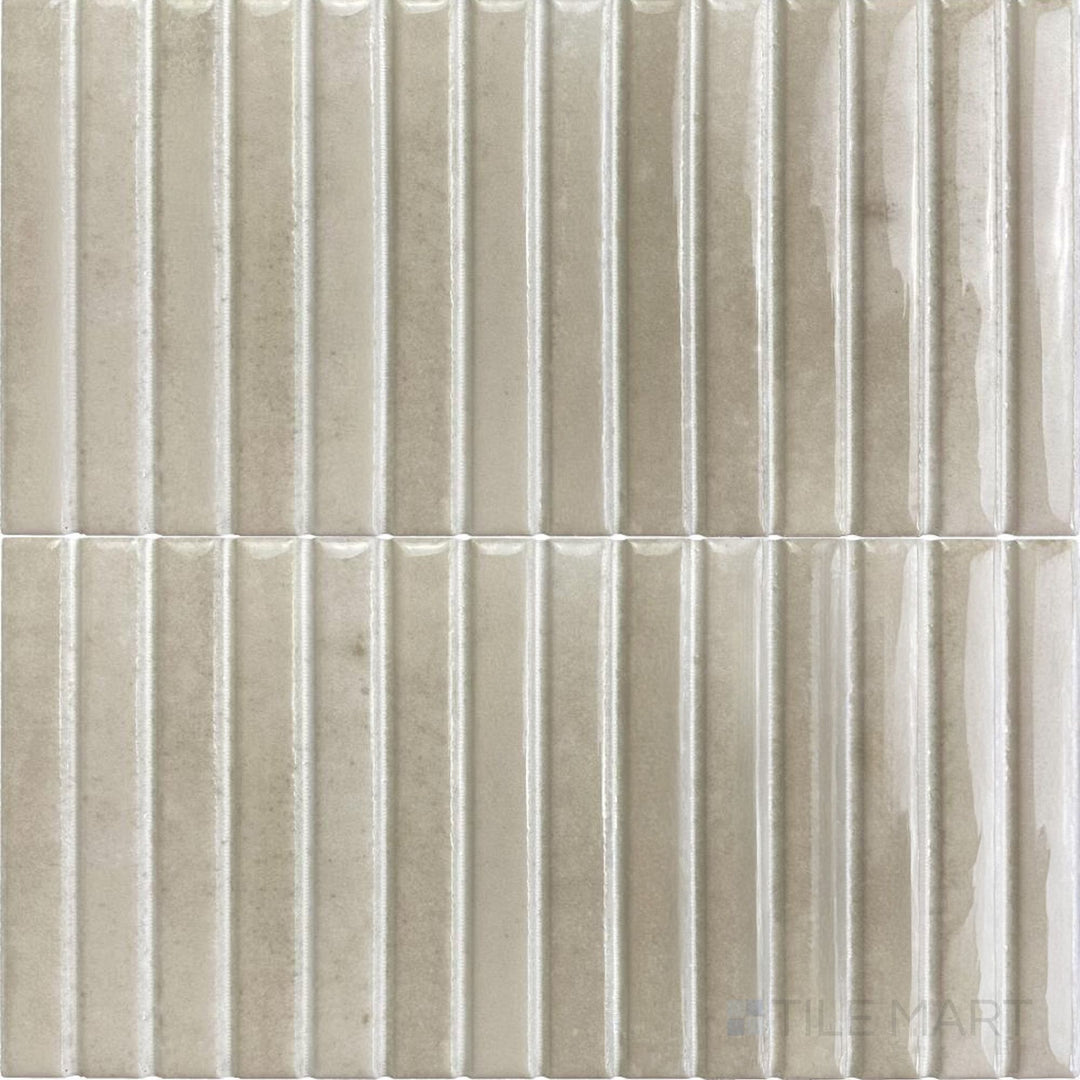 Soft ivory hues blend with a glossy surface in this Kit Kat mosaic tile, offering a warm and timeless look.