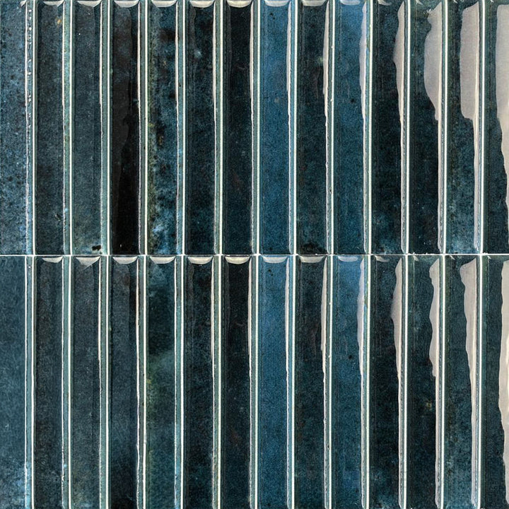 Deep ocean blue shades and sleek gloss define this Kit Kat porcelain mosaic with a modern, aquatic feel.