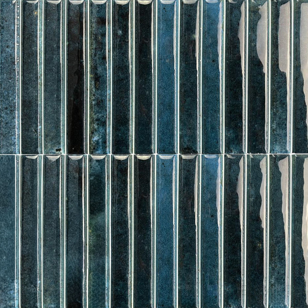 Deep ocean blue shades and sleek gloss define this Kit Kat porcelain mosaic with a modern, aquatic feel.