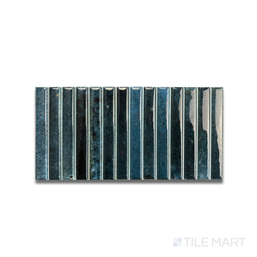 Overhead image of Kit Kat Ocean mosaic featuring deep blue glossy pieces in a tight, vertical arrangement.