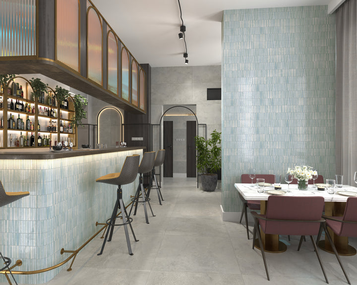 Kit Kat Water porcelain mosaic tile with a glossy aqua tone, bringing a fresh and fluid look to modern design spaces.