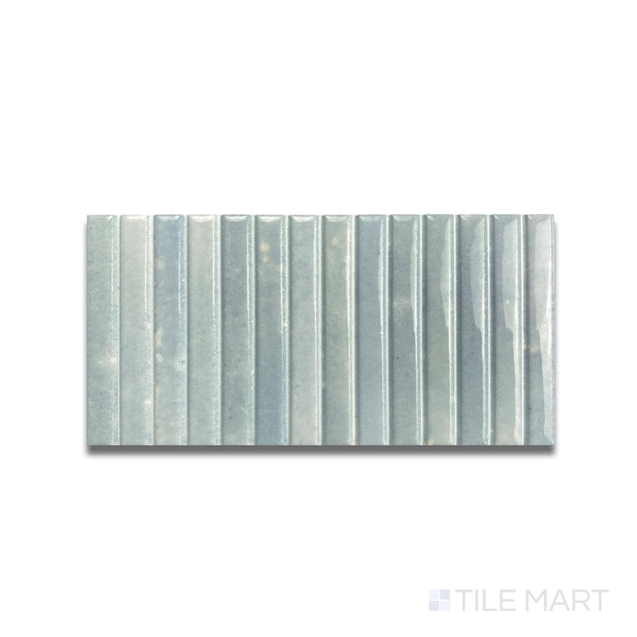 Top-down shot of Kit Kat Water mosaic with soft aqua tones and a reflective finish in a vertical stick pattern.