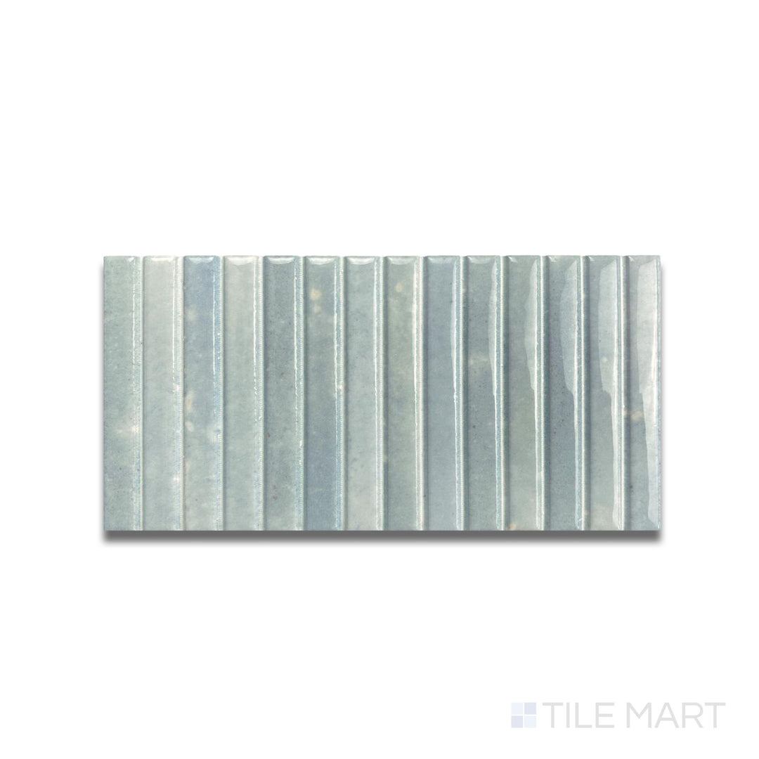 Top-down shot of Kit Kat Water mosaic with soft aqua tones and a reflective finish in a vertical stick pattern.