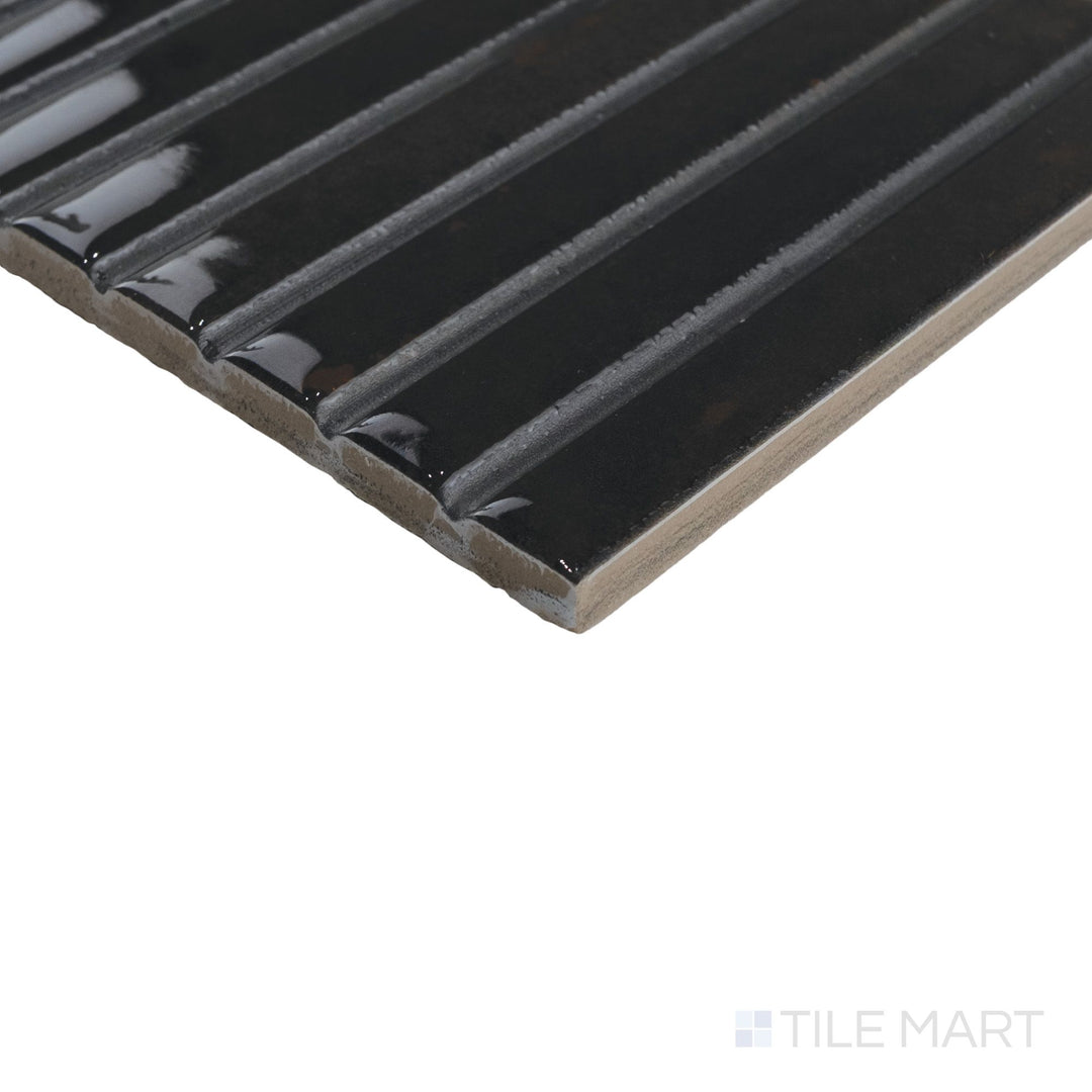 Corner detail of Kit Kat Noche mosaic emphasizing its dark glossy tiles and uniform vertical layout.