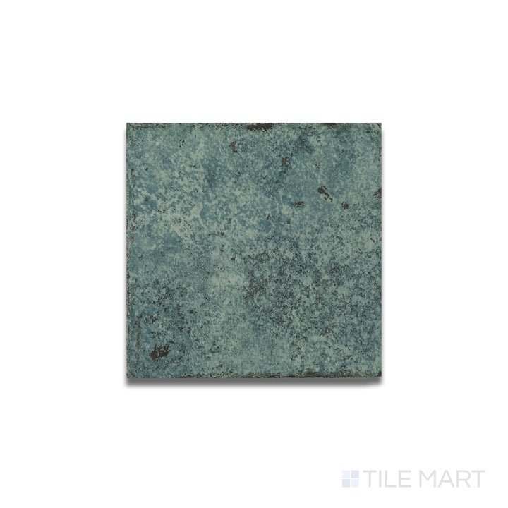 Top-down view of Tahiti Emerald matte porcelain tile featuring a textured R11 surface and rich green tone in 6x6 format.
