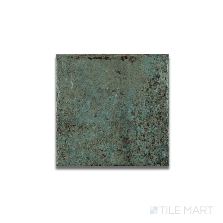 Flat lay of Tahiti Emerald glossy porcelain tile revealing a reflective finish and vibrant jewel-toned surface.