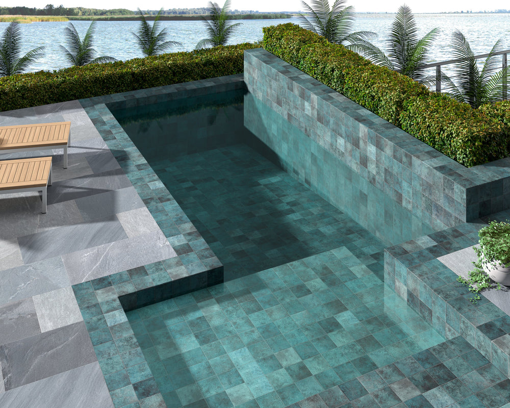 Glossy porcelain tile in Tahiti Turquoise, adding vibrant blue-green color and reflective finish to contemporary interiors.