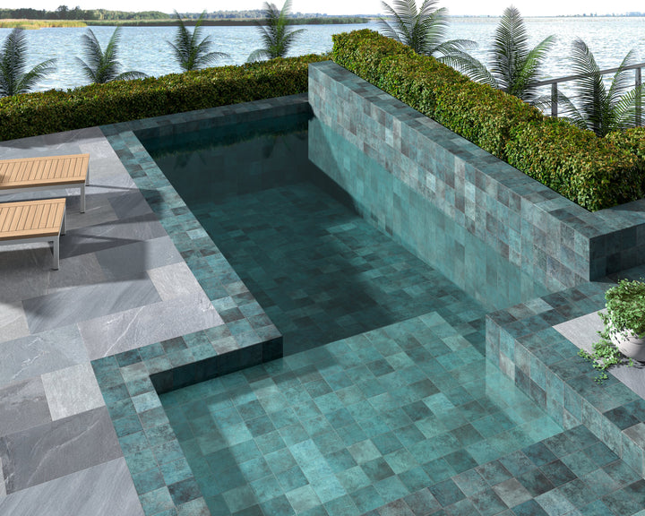 Glossy porcelain tile in Tahiti Turquoise, adding vibrant blue-green color and reflective finish to contemporary interiors.