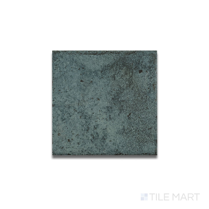 Overhead shot of Tahiti Turquoise bullnose tile with a matte R11 surface and neatly curved edge in a bold turquoise tone.