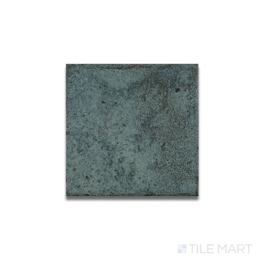Overhead shot of Tahiti Turquoise bullnose tile with a matte R11 surface and neatly curved edge in a bold turquoise tone.