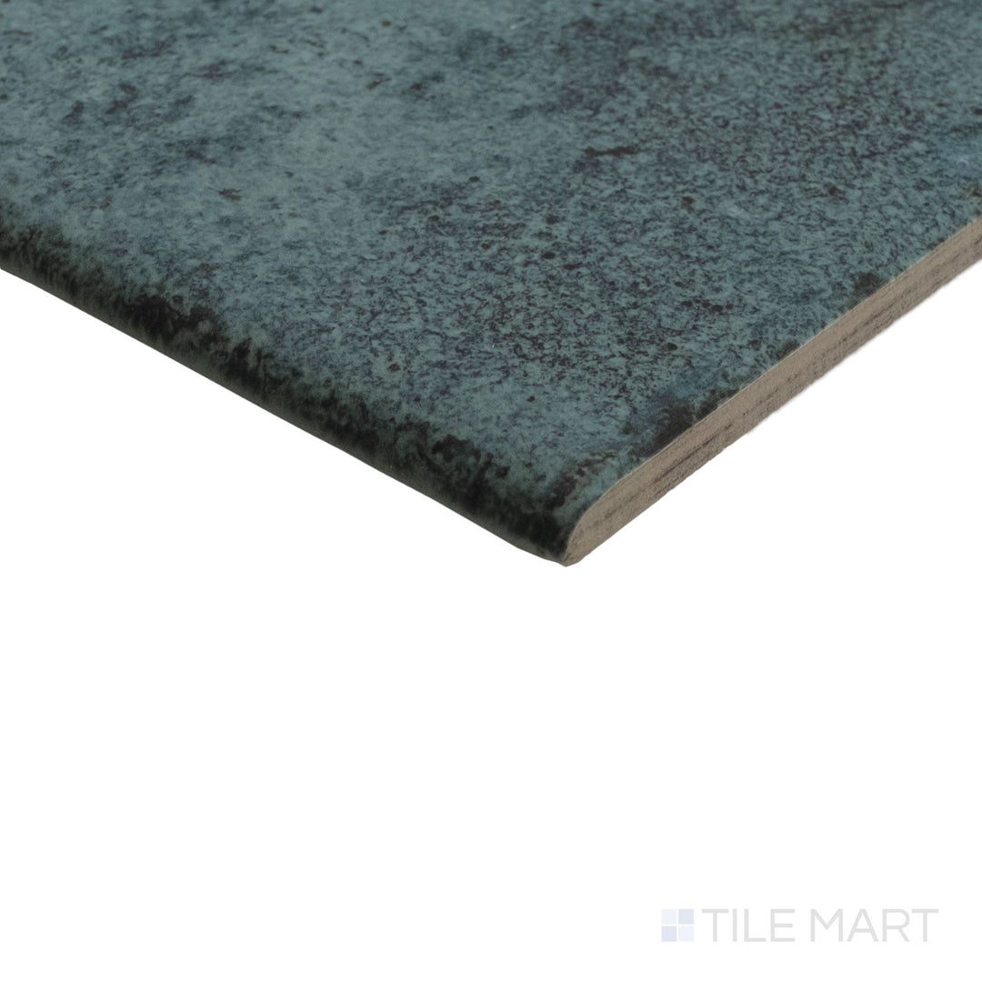 Angled view of Tahiti Turquoise 6x6 bullnose tile with R11 matte surface and neatly curved finished edge.