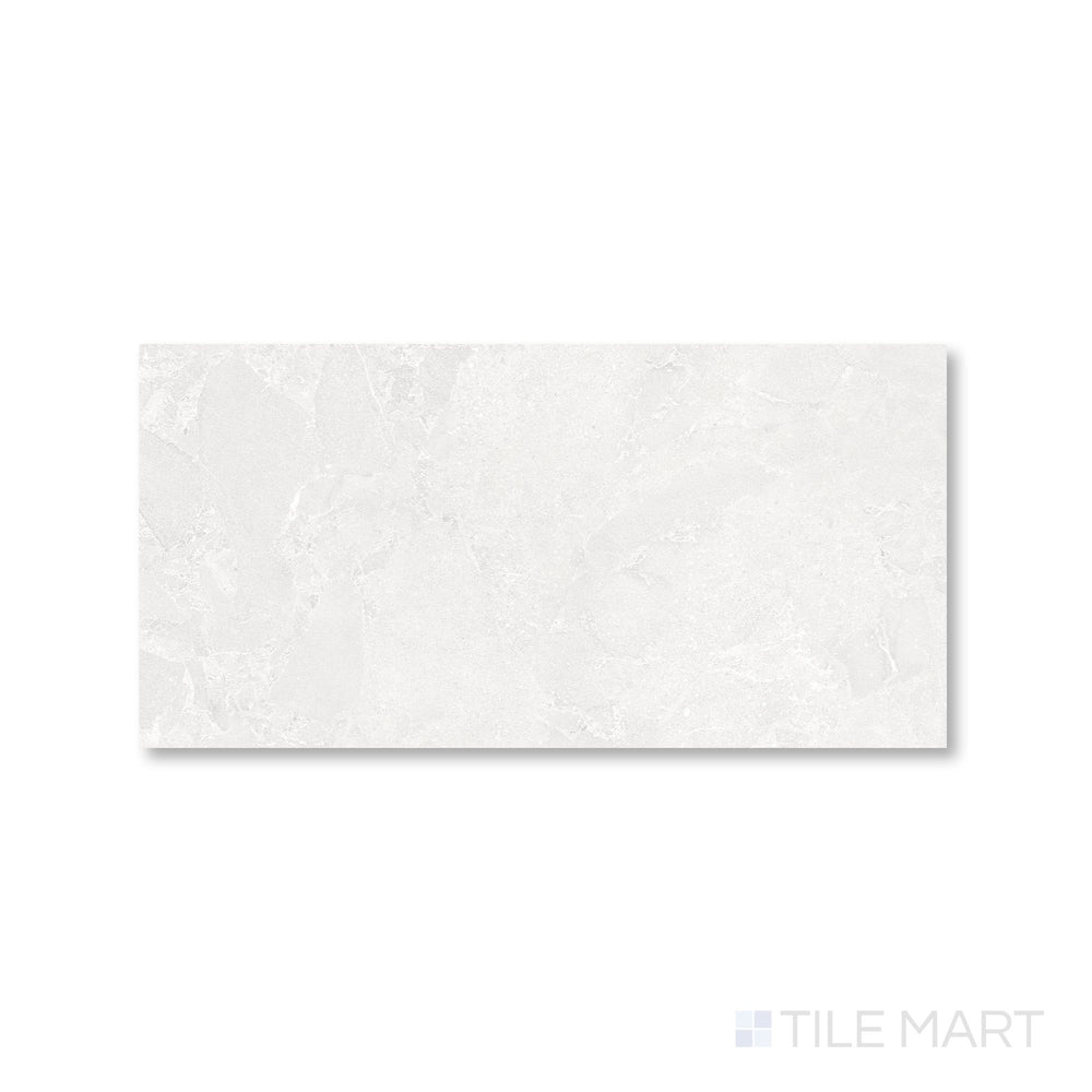 Overhead view of Avalon Blanco 12x24 porcelain tile showcasing its soft white tone and smooth matte texture.