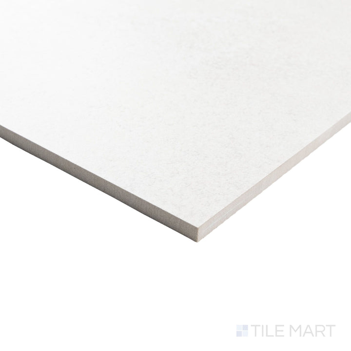 Corner view of Avalon Blanco 24x24 matte porcelain tile with a subtle stone-like finish and precise square edge.