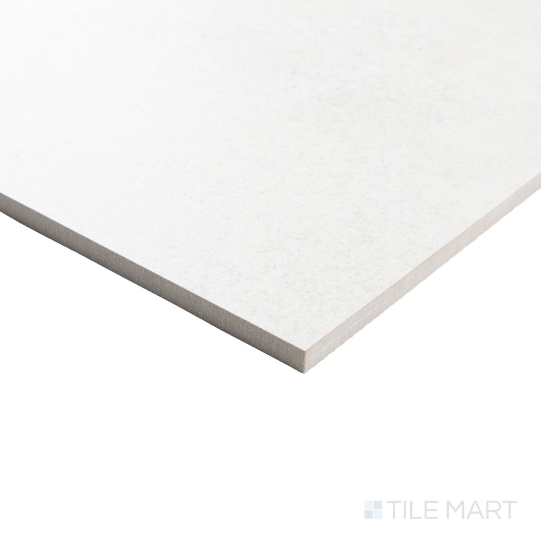 Corner perspective of Avalon Blanco 48x48 matte tile emphasizing its expansive surface and subtle stone effect along a clean edge.