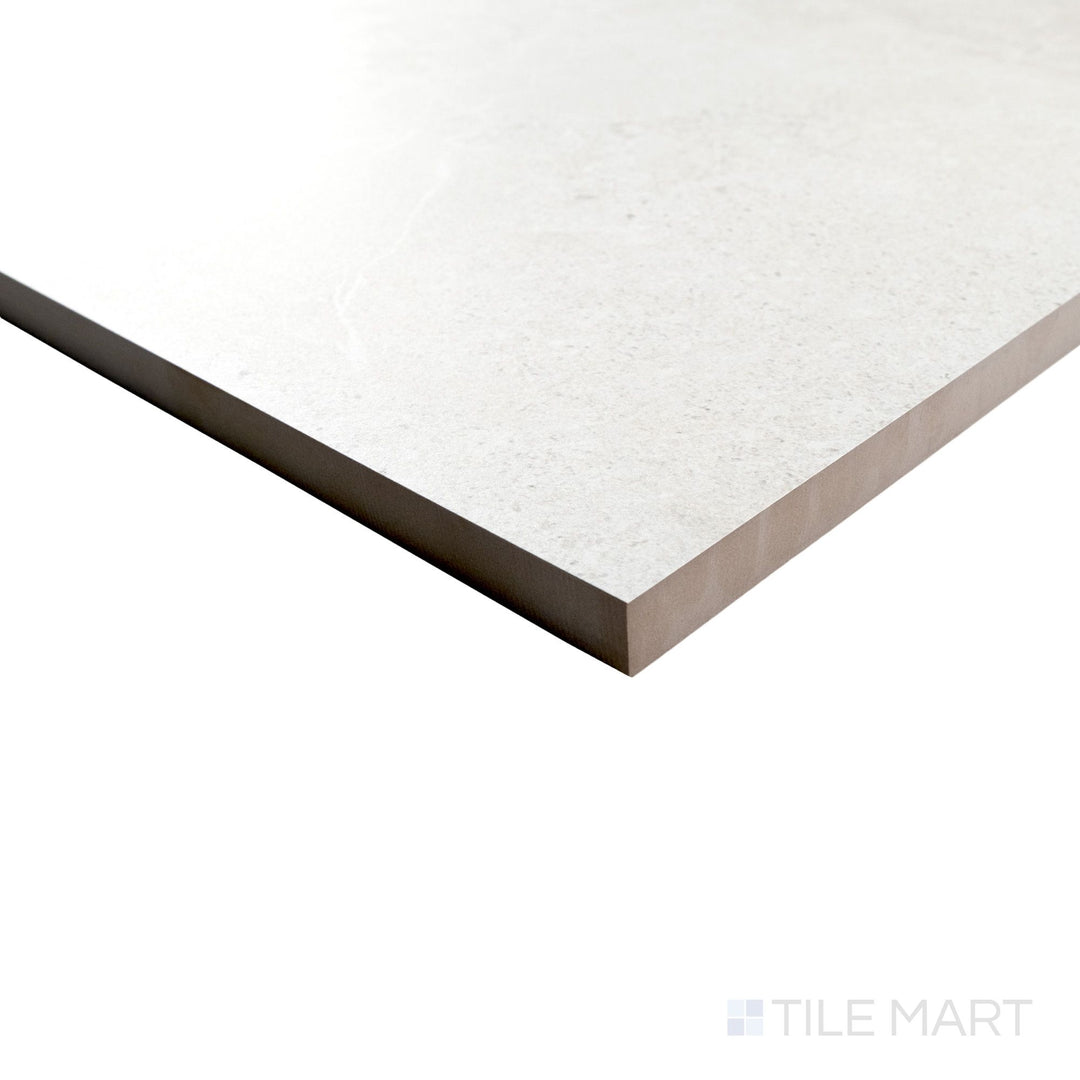 Corner view of Avalon Blanco 24x36 porcelain paver showing light color and natural texture wrapping around the edge.