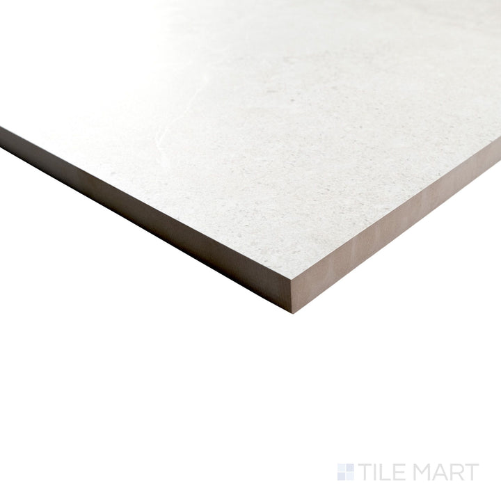 Corner view of Avalon Blanco 24x36 porcelain paver showing light color and natural texture wrapping around the edge.