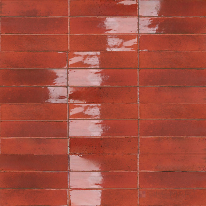 Fiery red tones with a bright finish bring bold energy to this 3x11 Agadir Lava porcelain tile.
