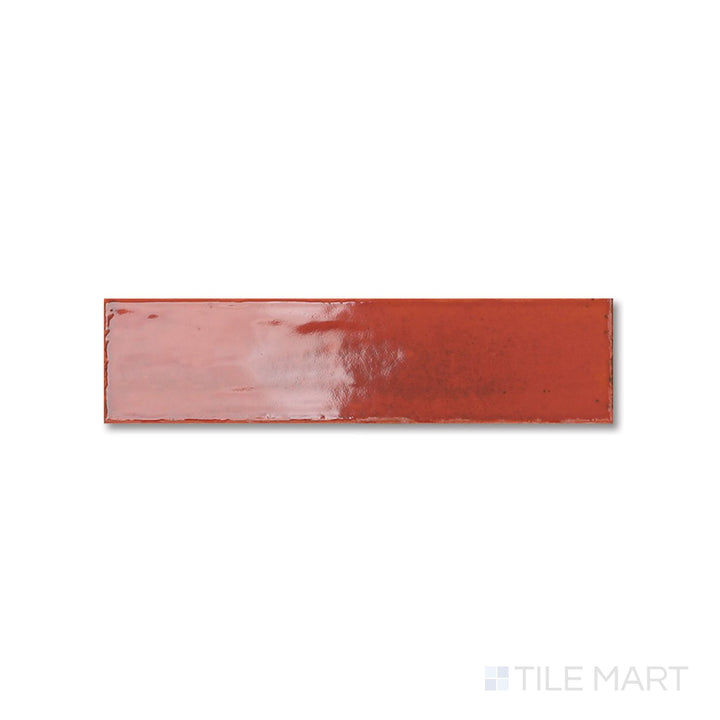 Aerial shot of Agadir Lava 3x11 bright porcelain tile capturing its bold red hue and reflective glazed surface.