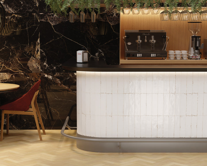 Agadir Niebla 3x11 glossy porcelain tile in soft gray hues, ideal for contemporary wall accents.