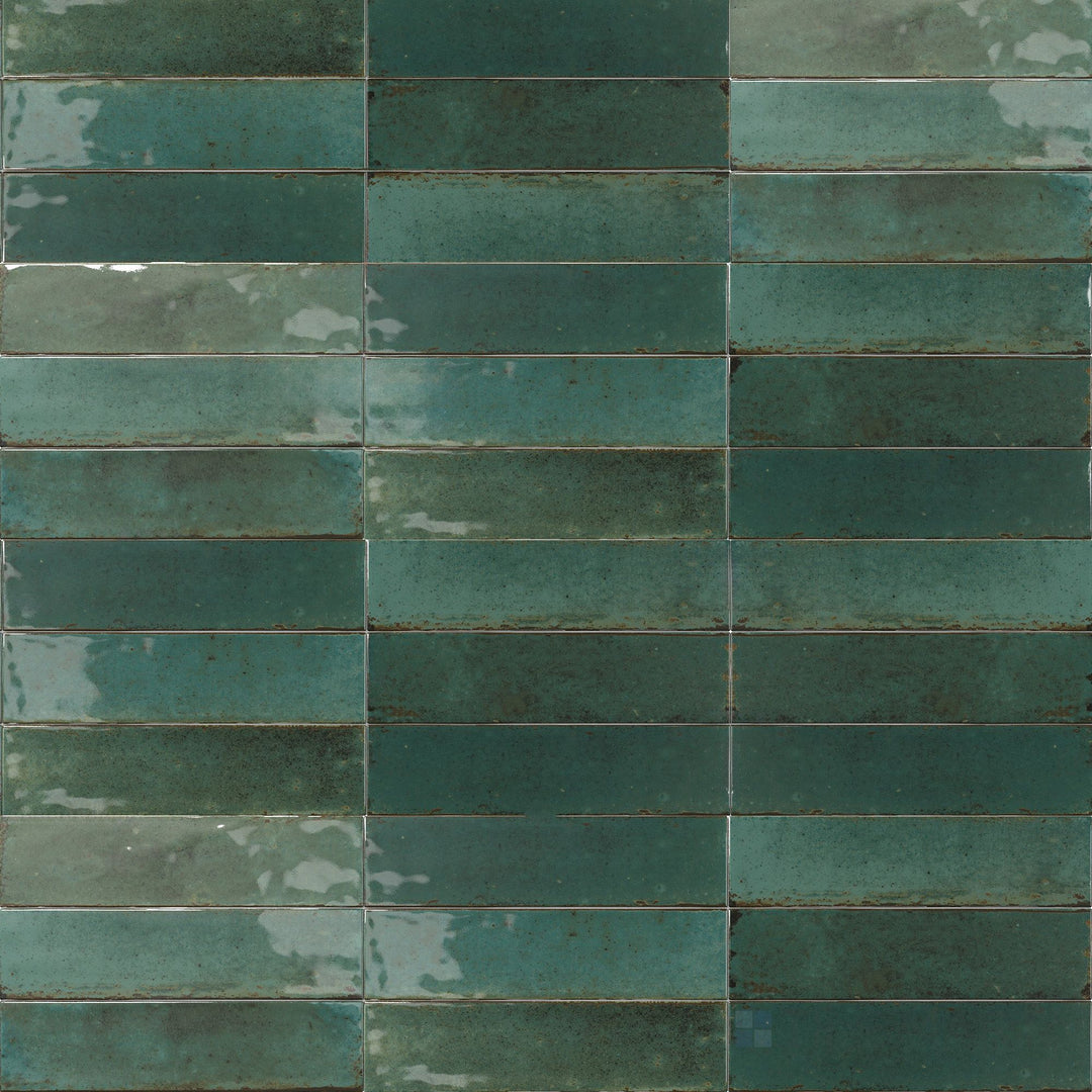 Lush green tones and a high-gloss surface create a rich, nature-inspired look in this 3x11 Agadir Selva tile.