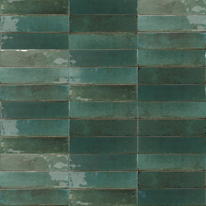 Lush green tones and a high-gloss surface create a rich, nature-inspired look in this 3x11 Agadir Selva tile.