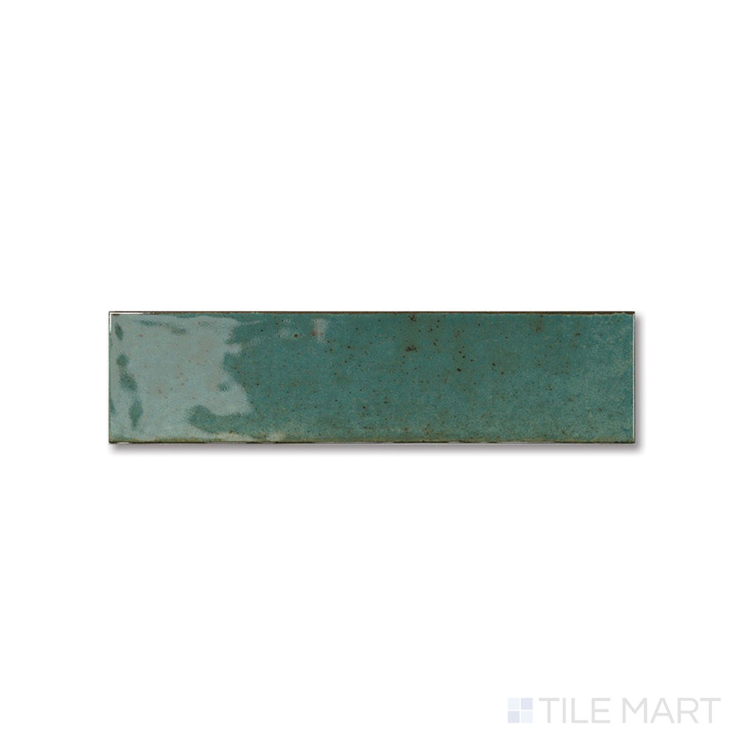 Flat view of Agadir Selva tile revealing its rich green gloss and sleek, narrow 3x11 layout.