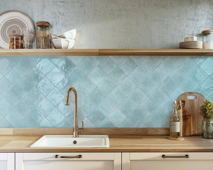 Agadir Agua 6x6 glossy porcelain tile in fresh aqua tones, perfect for adding brightness and vibrancy to surfaces.