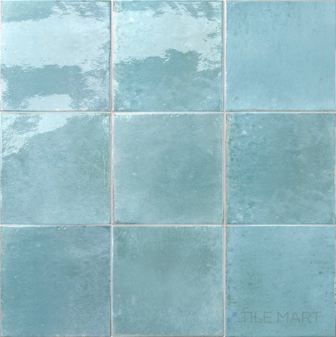 Bright aqua color with a polished look defines this 6x6 Agadir Agua porcelain tile.