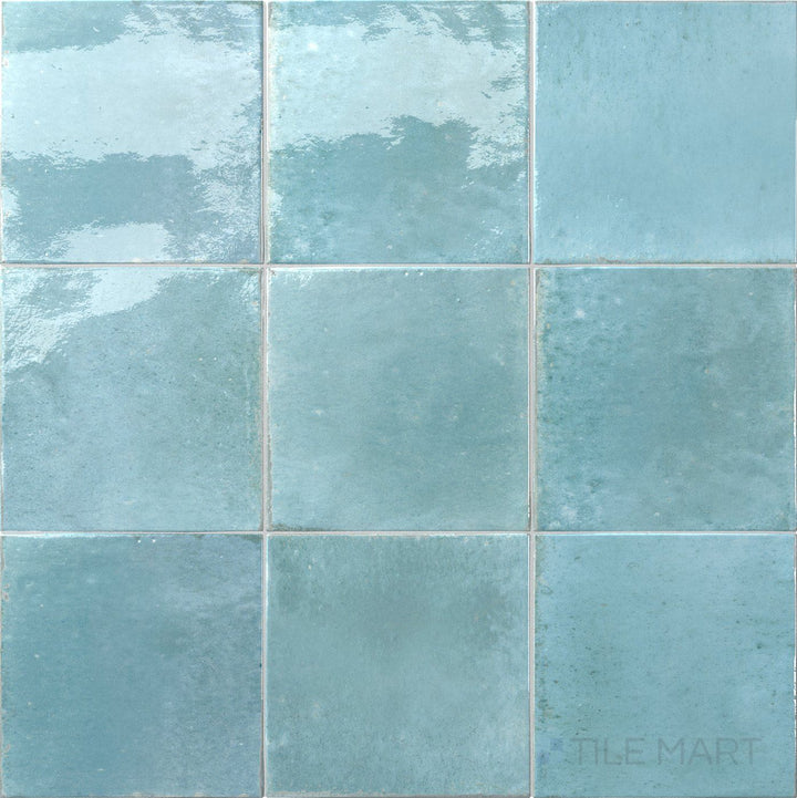 Bright aqua color with a polished look defines this 6x6 Agadir Agua porcelain tile.