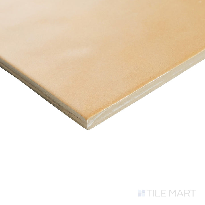 Corner shot of Agadir Cotto Oscuro 6x6 tile highlighting its warm, rustic matte finish and softly contoured edge.