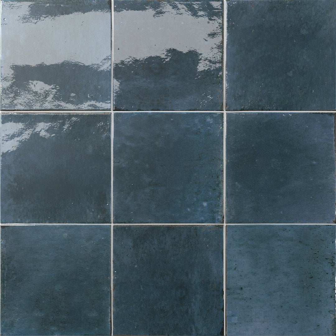 Vivid lake-blue hues and a sleek glossy surface bring fresh character to this 6x6 Agadir Lago tile.
