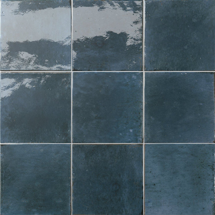 Vivid lake-blue hues and a sleek glossy surface bring fresh character to this 6x6 Agadir Lago tile.