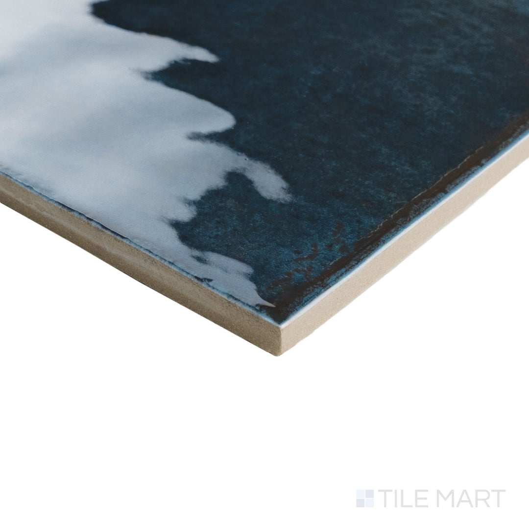 Angled corner view of Agadir Lago 6x6 tile showing rich blue gloss and defined porcelain edge.