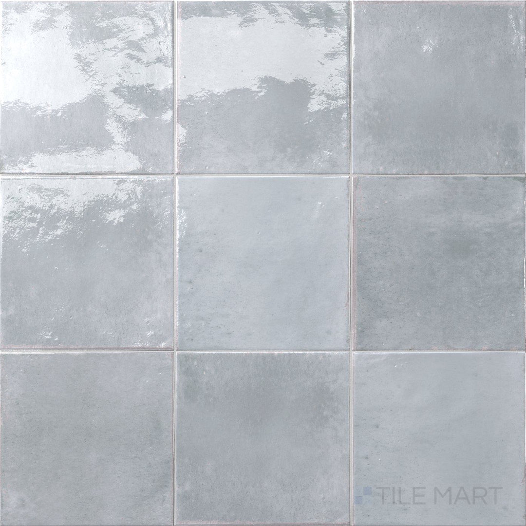 A natural stone appearance meets high shine in this 6x6 Agadir Piedra bright porcelain tile.