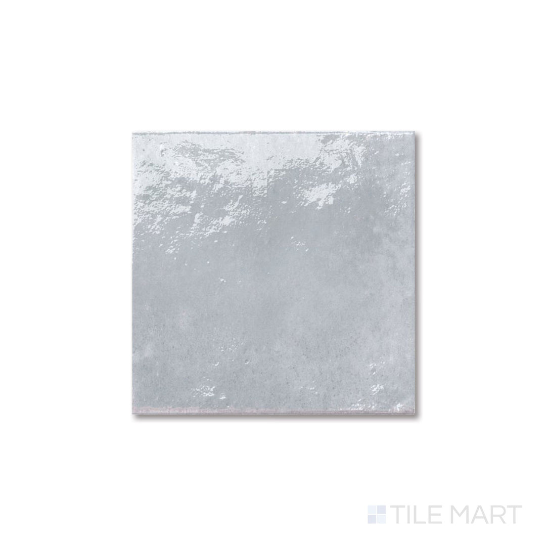 Flat perspective of Agadir Piedra tile with stone-inspired coloring and a glossy 6x6 format.