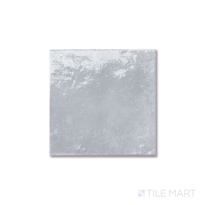 Flat perspective of Agadir Piedra tile with stone-inspired coloring and a glossy 6x6 format.