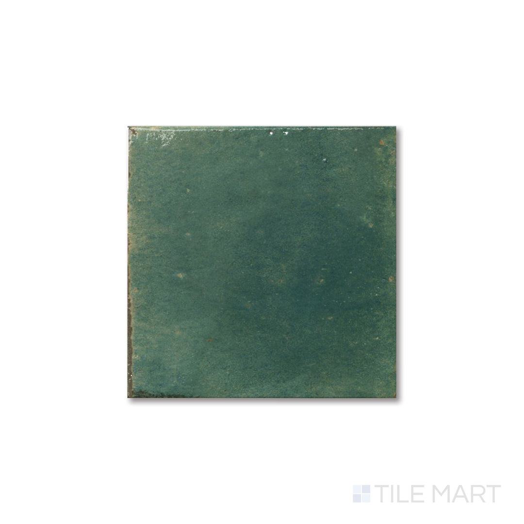Overhead view of Agadir Selva 6x6 tile showcasing deep green color and reflective bright porcelain finish.