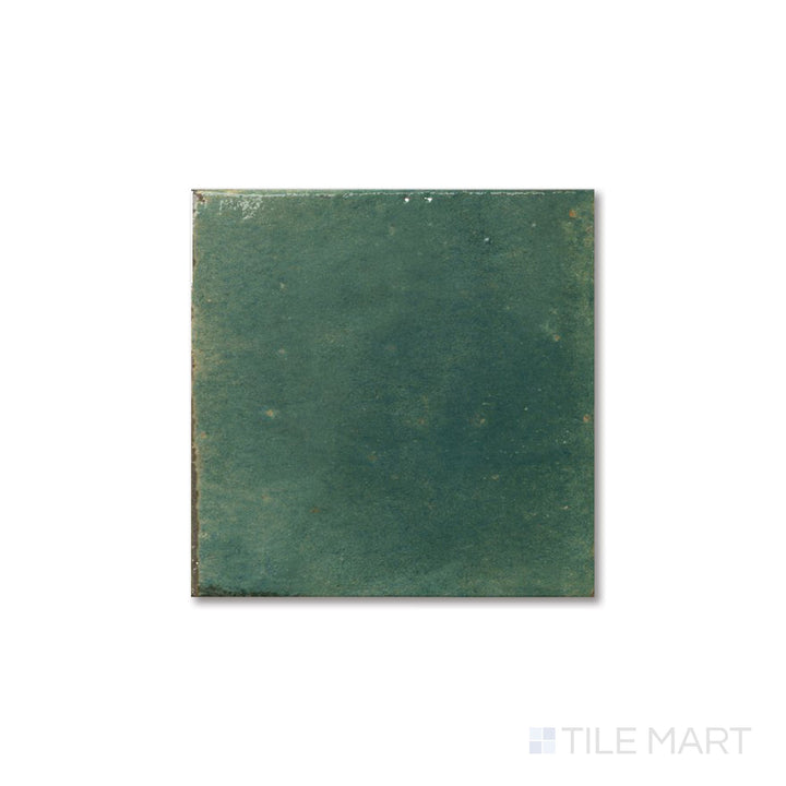 Overhead view of Agadir Selva 6x6 tile showcasing deep green color and reflective bright porcelain finish.