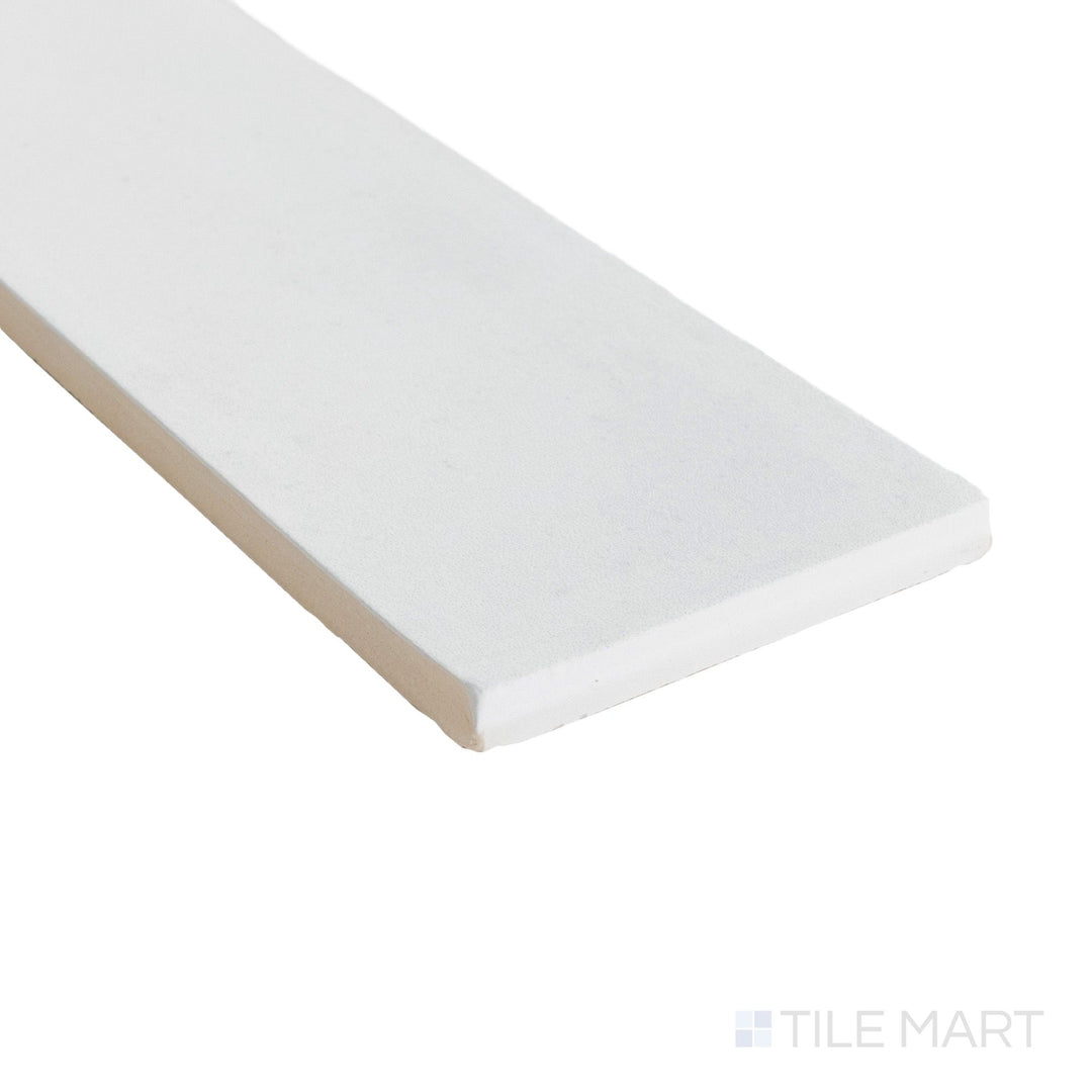 Corner shot of Milano Gesso 3x9 matte tile showcasing its soft white tone and finely defined porcelain edge.