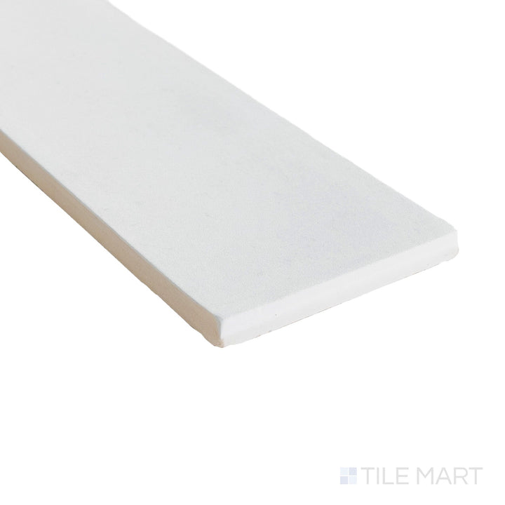 Corner shot of Milano Gesso 3x9 matte tile showcasing its soft white tone and finely defined porcelain edge.