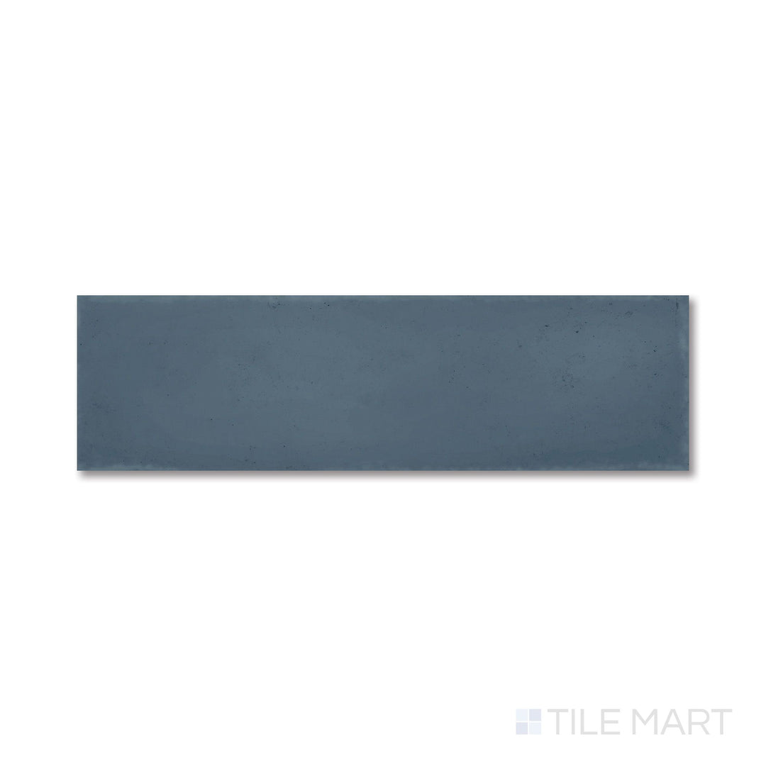 Flat shot of Milano Blu 3x9 tile showcasing its rich navy tone and smooth matte porcelain texture.