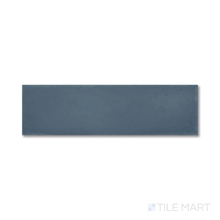 Flat shot of Milano Blu 3x9 tile showcasing its rich navy tone and smooth matte porcelain texture.