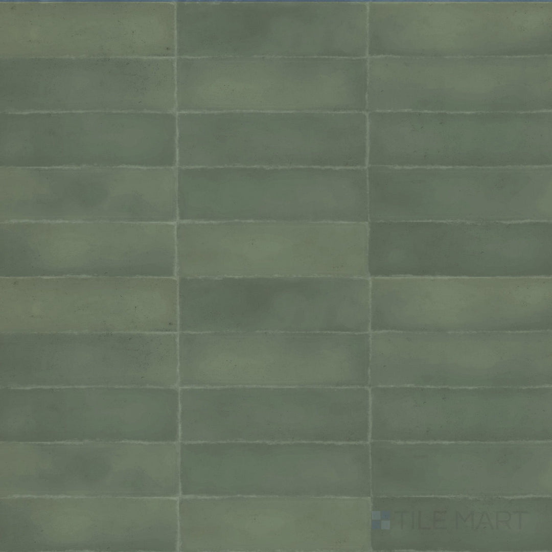 Earthy green-brown hues with a muted surface define the natural aesthetic of this 3x9 Milano Bosco tile.