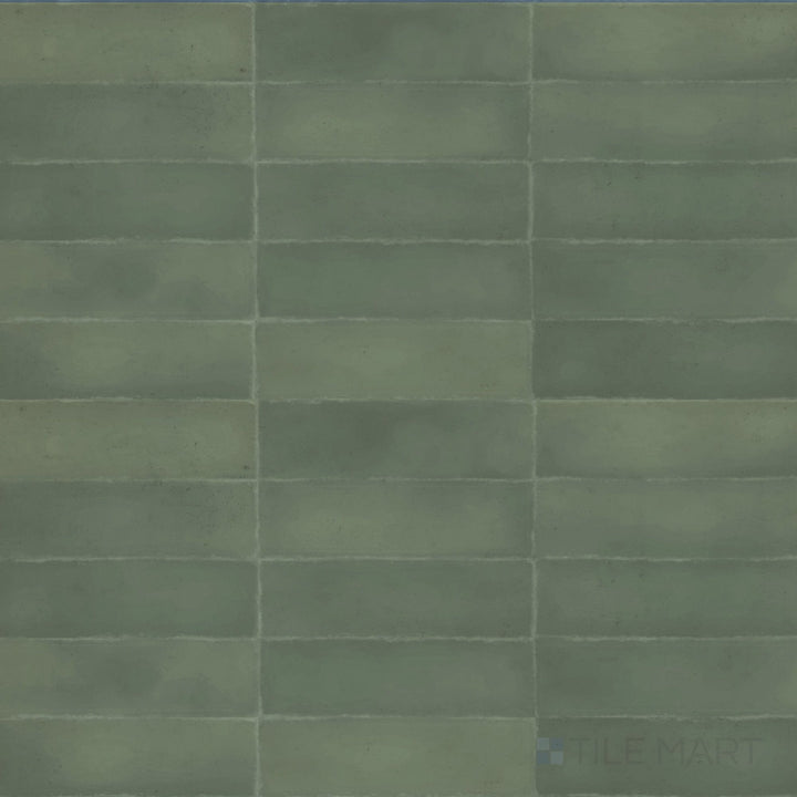 Earthy green-brown hues with a muted surface define the natural aesthetic of this 3x9 Milano Bosco tile.