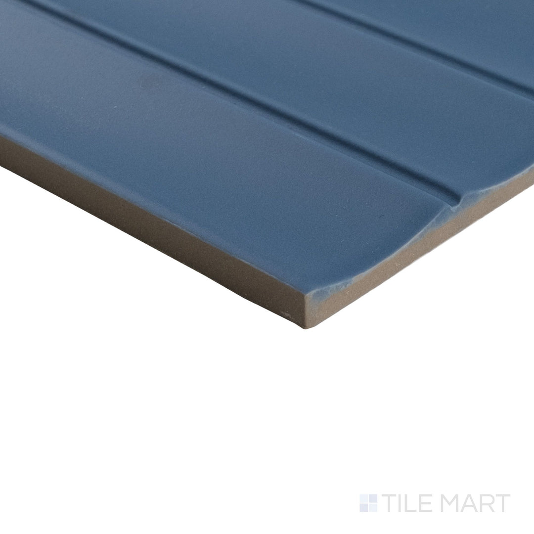 Angled shot of Milano Scala Blu 4.5x9 tile with rich blue matte tone and distinct edge transition.