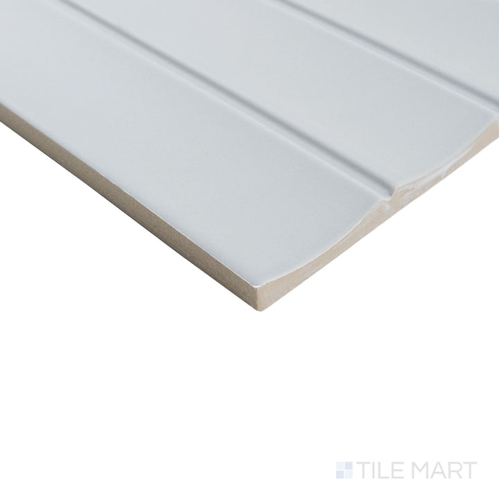 Corner perspective of Milano Scala Grigio 4.5x9 tile displaying neutral gray tone with structured edge detail.