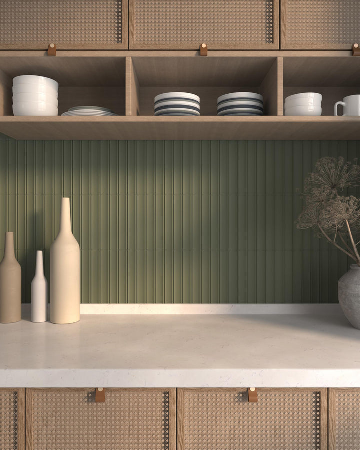 Milano Scala Bosco 4.5x9 matte porcelain tile in deep green with sculptural appeal for statement surfaces.