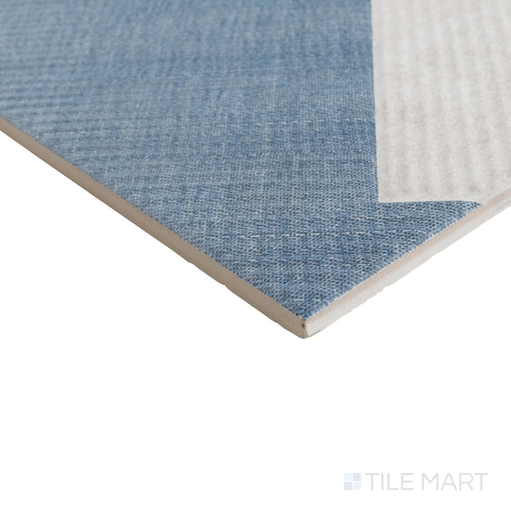 Angled corner image of Stripes Denim 10x10 tile with muted blue matte surface and subtle striping extending to the edge.