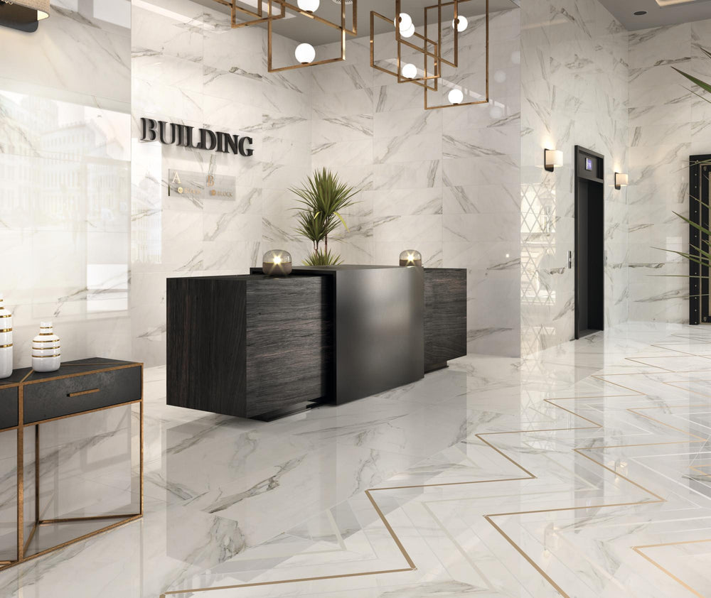 Lifestyle image of Calacatta Lux Superwhite 24x24 satin porcelain tile in a real interior, highlighting soft marble veining and smooth finish.